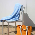 Mono-Bath-Towel-sky-blue_Everyday-Tote-Bag-mango_Type-Chair-silver-grey-aluminium.jpg