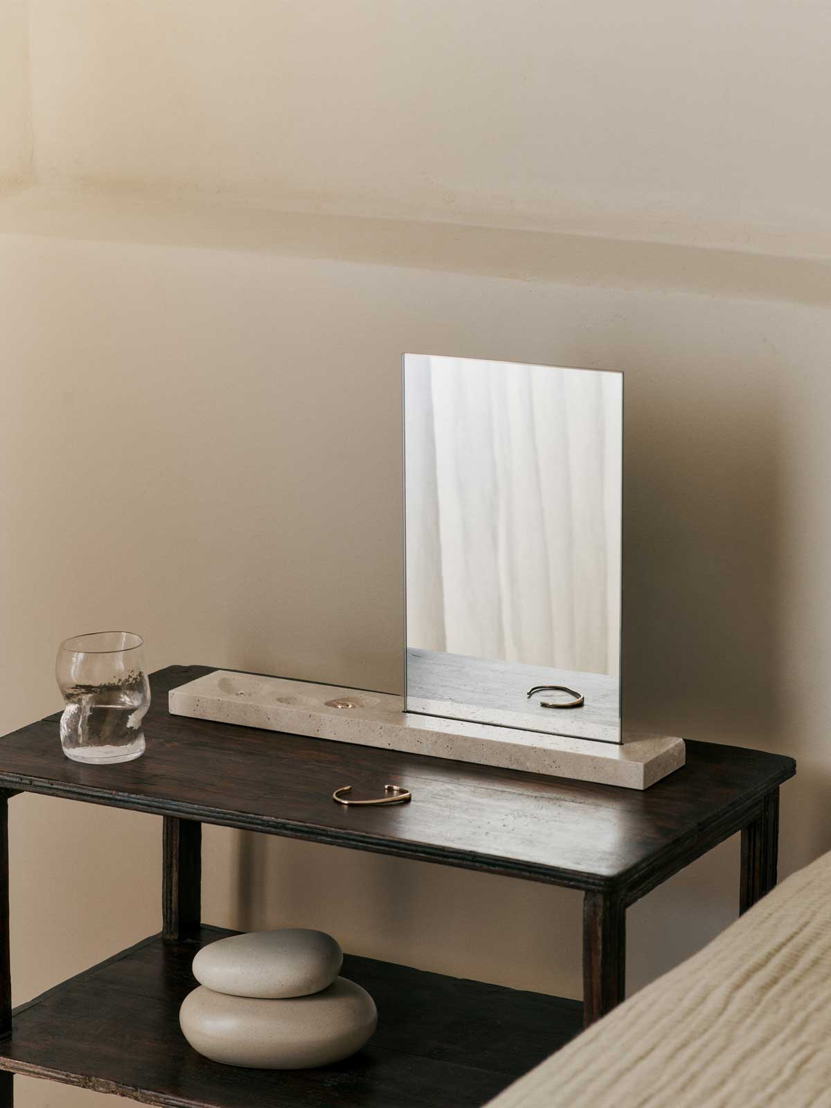 FermLiving_SS25_CasetaTableMirror_Travertine_1104271109_PebbleBox_Medium_SandCream_1104270731_DimpleGlasses_SetOf2_Clear_1104270155.jpg