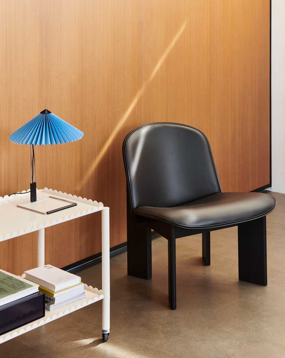 Matin-Table-Lamp-300-placid-blue-mirror-plated-steel-base_Chisel-Lounge-Chair-front-uph-Sense-black-black-wb-lacquered-oak.jpg