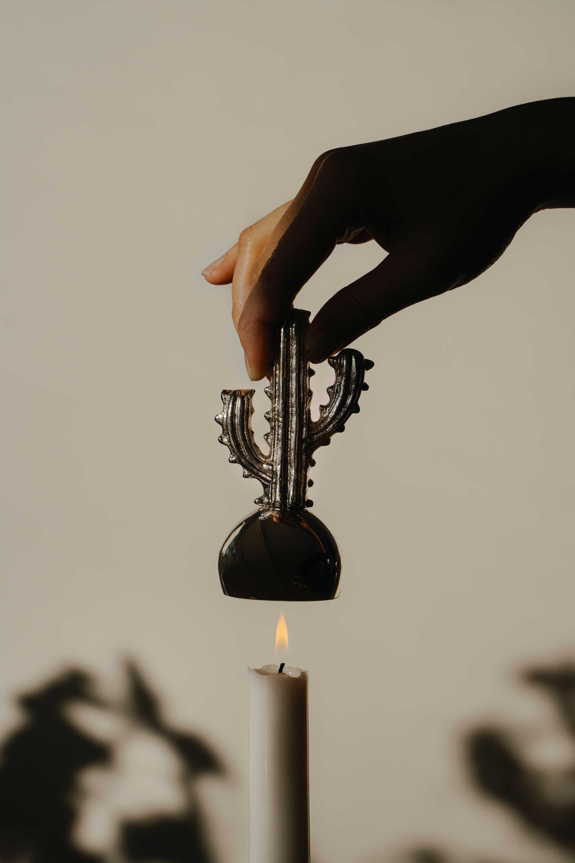 Candlesnuffer_with_hand_high.jpg