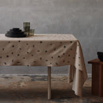 FermLiving_Holiday2025_BaiesTablecloth_NaturalDarkChocolate_1104271887_BoyaLowGlasses_SetOf2_SmokedGrey_1104272028_BoyaTallGlasses_SetOf2_SmokedGrey_1104272031.jpg