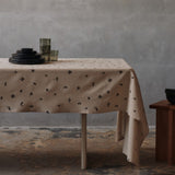 FermLiving_Holiday2025_BaiesTablecloth_NaturalDarkChocolate_1104271887_BoyaLowGlasses_SetOf2_SmokedGrey_1104272028_BoyaTallGlasses_SetOf2_SmokedGrey_1104272031.jpg
