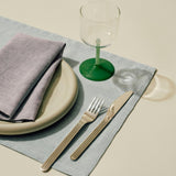 Tint Wine Glass clear and jade light green and jade dark green_Tavolo Placemat soft blue_Tavolo Napkin soft purple.jpg