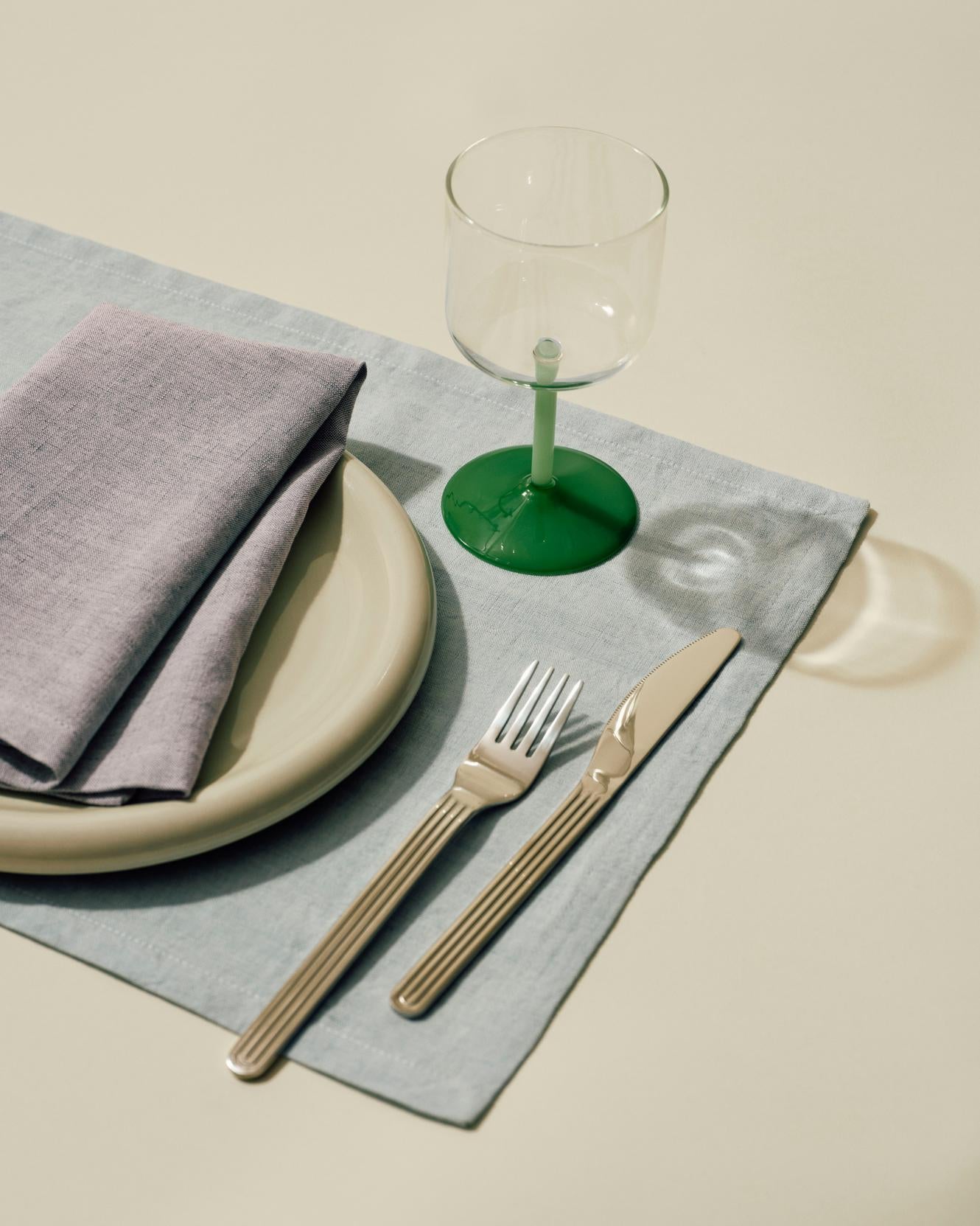 Tint Wine Glass clear and jade light green and jade dark green_Tavolo Placemat soft blue_Tavolo Napkin soft purple.jpg