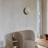 fermLIVING_SS23_VaultSideTable_1104267283_RicoLoungeChair_1104267276_ArumWallSconce_1104266373_1104266376_image_01.jpg