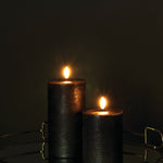 Pillar Candles (forest black) - dark room on reflective side table-medium.jpg