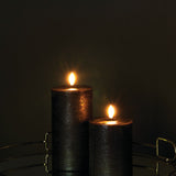 Pillar Candles (forest black) - dark room on reflective side table-medium.jpg