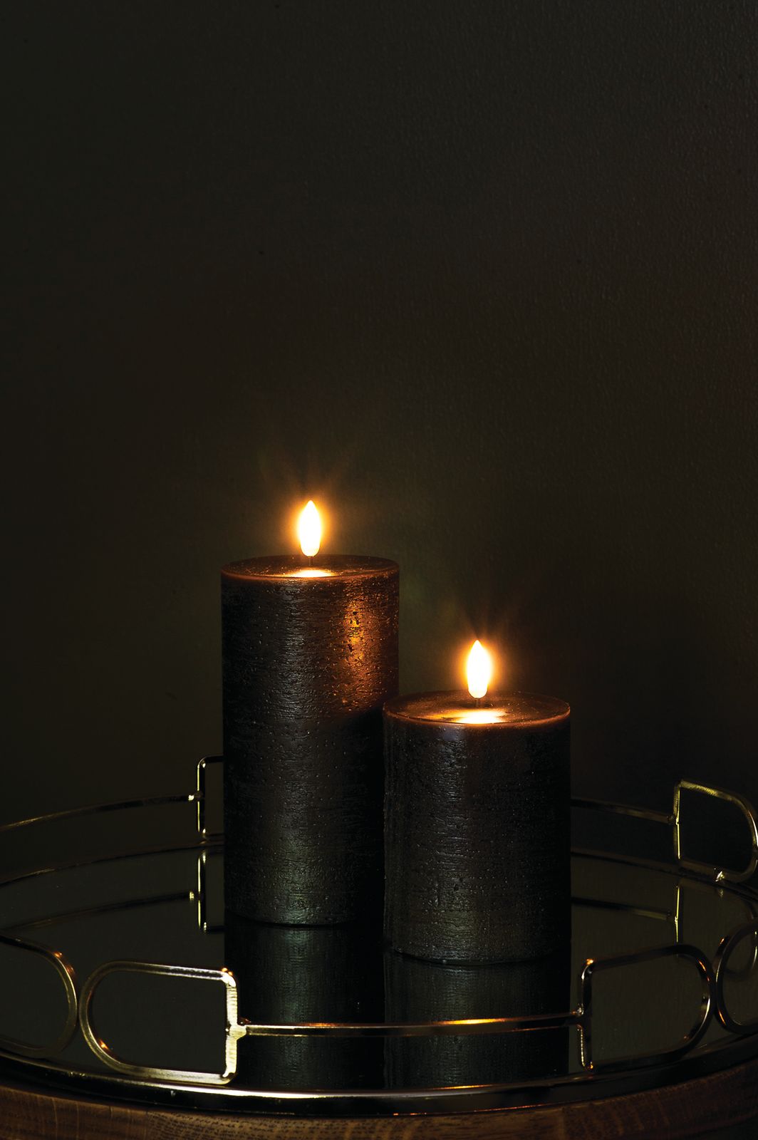 Pillar Candles (forest black) - dark room on reflective side table-medium.jpg