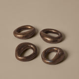FermLiving_SS26_PackshotsWithBackground_OrrithNapkinRings_SetOf4_RusticBronze_1104272495.jpg