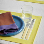 Ram-Placemat-yellow_Ram-Napkin-purple_Barro-Plate-24-set-of-2-dark-blue_Glass-M_MVS-Cutlery-set-of-4-yellow.jpg