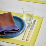 Ram-Placemat-yellow_Ram-Napkin-purple_Barro-Plate-24-set-of-2-dark-blue_Glass-M_MVS-Cutlery-set-of-4-yellow.jpg