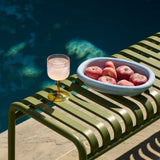 Tint-Wine-Glass-pink-and-yellow_Barro-Oval-Dish-S-light-blue_Palissade-Bench-olive.jpg
