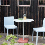 Elementaire-Chair-blue-grey_Terrazzo-Table-Round-sky-grey-red-base_Tint-Glass-green_Jug-clear.jpg