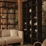 FermLiving_KonaBookcase_3x6_DarkStained_1104272382_FaldaSmockedCushion_Undyed_1104272242_1104272378_BellureCentrepiece_35_RusticBronze_1104272110_BellureBowl_17_RusticBronze_1104272111_BurlStorageCoffeeTable_Da.jpg