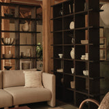 FermLiving_KonaBookcase_3x6_DarkStained_1104272382_FaldaSmockedCushion_Undyed_1104272242_1104272378_BellureCentrepiece_35_RusticBronze_1104272110_BellureBowl_17_RusticBronze_1104272111_BurlStorageCoffeeTable_Da.jpg