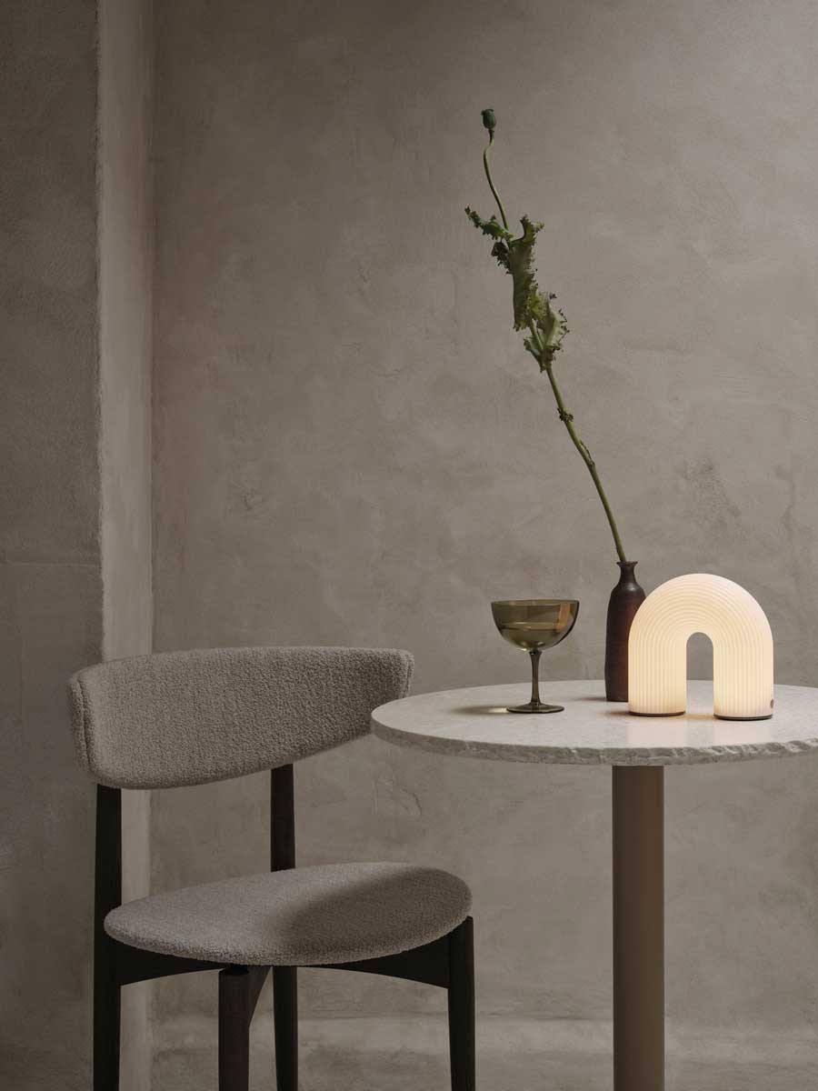 fermLIVING_AW24_VueltaPortableLamp_1104270173_HostCocktailGlasses_SetOf2_MossGreen_1104269475_HermanDiningChair_WoodFrame_DarkStainedBeech_SoftBouclé_Natural_1104269393.jpg