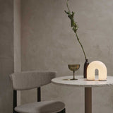 fermLIVING_AW24_VueltaPortableLamp_1104270173_HostCocktailGlasses_SetOf2_MossGreen_1104269475_HermanDiningChair_WoodFrame_DarkStainedBeech_SoftBouclé_Natural_1104269393.jpg