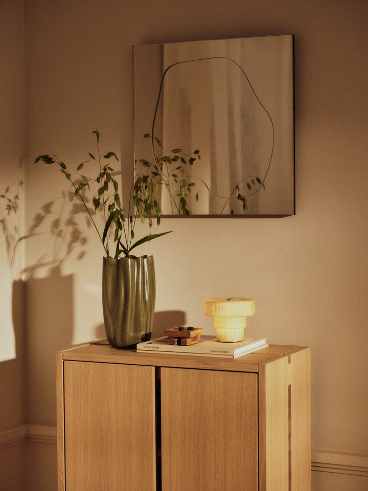 FermLiving_SS26_FoliaMirror_1104272079_NiumVase_1104272493_RipplePortableLamp_1104272783_ParcelHallwayCabinet_1104273142.jpg