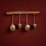 FermLiving_Holiday2026_WalnutOrnaments_SetOf2_Brass_1104274473_AcornOrnaments_SetOf2_Brass_1104274474.jpg
