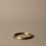 FermLiving_SS25_PackshotsWithBackground_LeveeTrivet_AntiqueBrass_1104270875.jpg