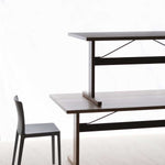 Passerelle-Table-black-lino-tabletop-ink-black-powder-coated-crossbar-wb-lacquered-oak-frame-and-edge_Passerelle-table-wb-lacquered-walnut-frame-and-edge-ink-black-powder-coated-crossbar.jpg