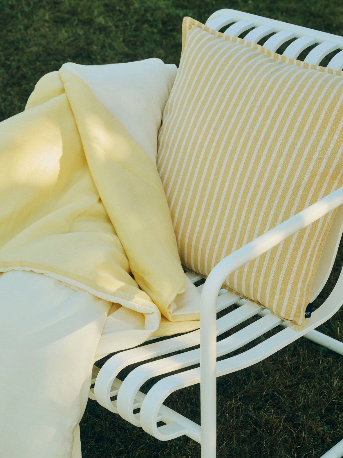 Air Quilt soft yellow_Terrazza Cushion Bold Stripe yellow_Palissade Cantilever Dining Armchair cream white.jpg