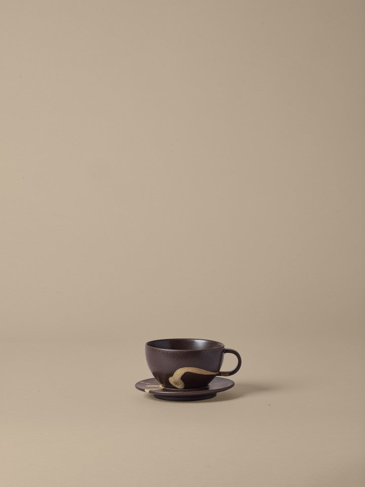 FermLiving_SS26_PackshotsWithBackground_KoyoCupWithSaucer_DarkBrown-Buff_1104272621.jpg