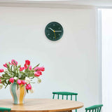 Triangle-Leg-Table-oiled-oak_J77-jade-green-wb-lacquer-beech_Sobremesa-Vase-L-green-and-yellow_Wall-Clock-black.jpg