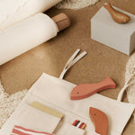 FermLiving_SS25_CanvasTravelPockets_Natural_1104271126_ShoalPuzzle_Multi_1104271086_HarbourBox_Fish_MistBlueAgedGold_1104271087.jpg