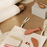 FermLiving_SS25_CanvasTravelPockets_Natural_1104271126_ShoalPuzzle_Multi_1104271086_HarbourBox_Fish_MistBlueAgedGold_1104271087.jpg