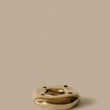 FermLiving_Holiday2026_PackshotsWithBackground_BellureRingCandleHolder_BrassFinish_1104273900.jpg
