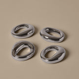 FermLiving_SS26_PackshotsWithBackground_OrrithNapkinRings_SetOf4_Silver_1104272494.jpg