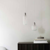 2022_Amp_Lamp_Small_Matt_White_605741_Amp_Lamp_Large_Matt_White_Rib_Cabinet_Black_Oak_01.jpg