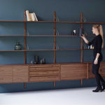 RS_BLUE-BACKGROUND_FROM-SIDE_WALNUT_STYLED_PERSON-(1).jpg