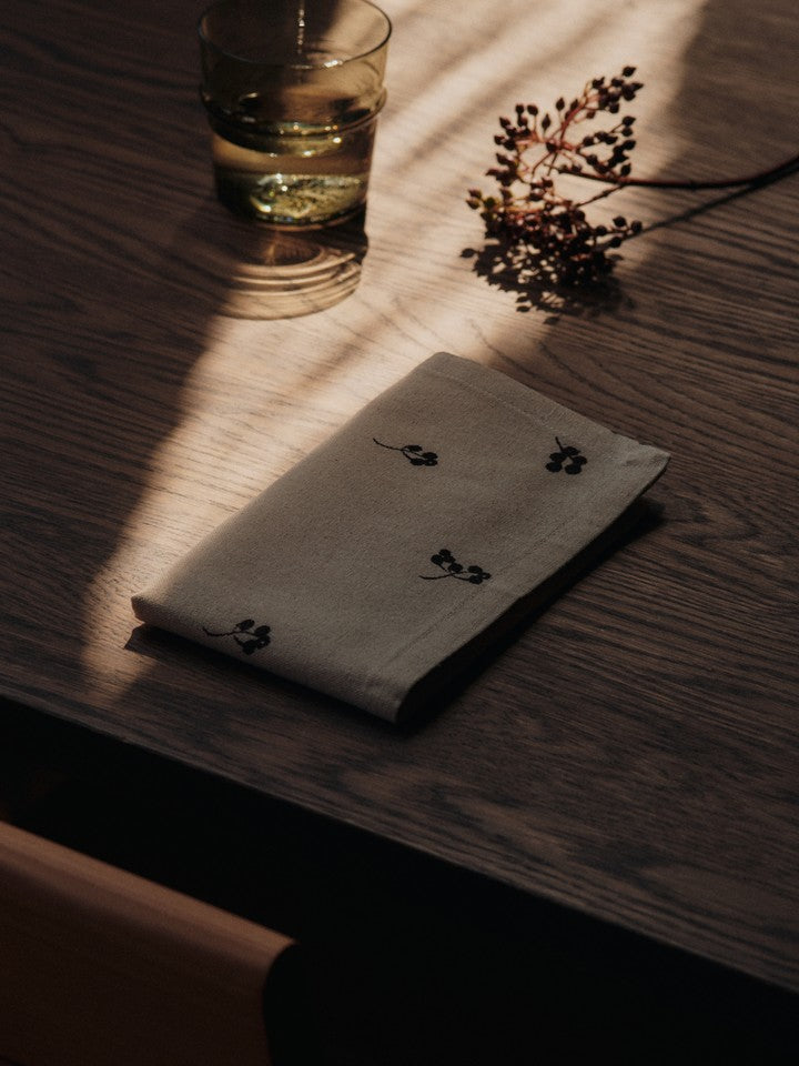 FermLiving_Holiday2025_BaiesNapkins_SetOf4_NaturalDarkChocolate_1104271888_BoyaLowGlasses_SetOf2_SmokedGrey_1104272028.jpg