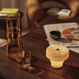 FermLiving_SS26_AturaDiningTable_1104273617_1104273616_RipplePortableLamp_1104272783_BoyaCarafe_1104272741.jpg
