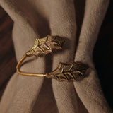 FermLiving_Holiday2025_HollyLeafNapkinRings_SetOf4_Brass_1104271779_3.jpg