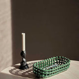 fermLIVING_SS24_CeramicBasketOval_EmeraldGreen_1104268939_GaleCandleHolder_H13_BlackenedAluminium_1104268693_1.jpg
