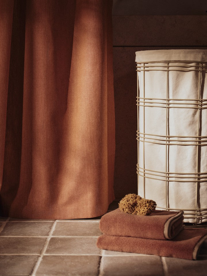 FermLiving_SS26_ChambrayShowerCurtain_1104272793_FioLaundryBasket_1104273166_EkkoHandTowel_1104272797_EkkoBathTowel_1104272800.jpg