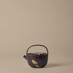 FermLiving_SS26_PackshotsWithBackground_KoyoTeapot_DarkBrown-Buff_1104272620.jpg